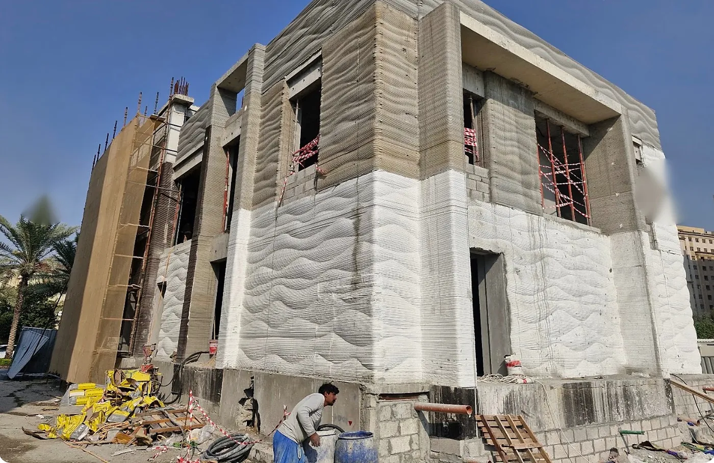 Facade during construction showing printed layers