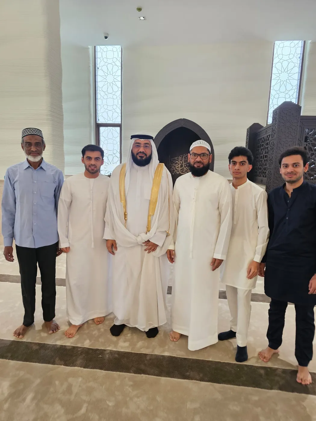 Mufti Habib with members of the community in the prayer hall