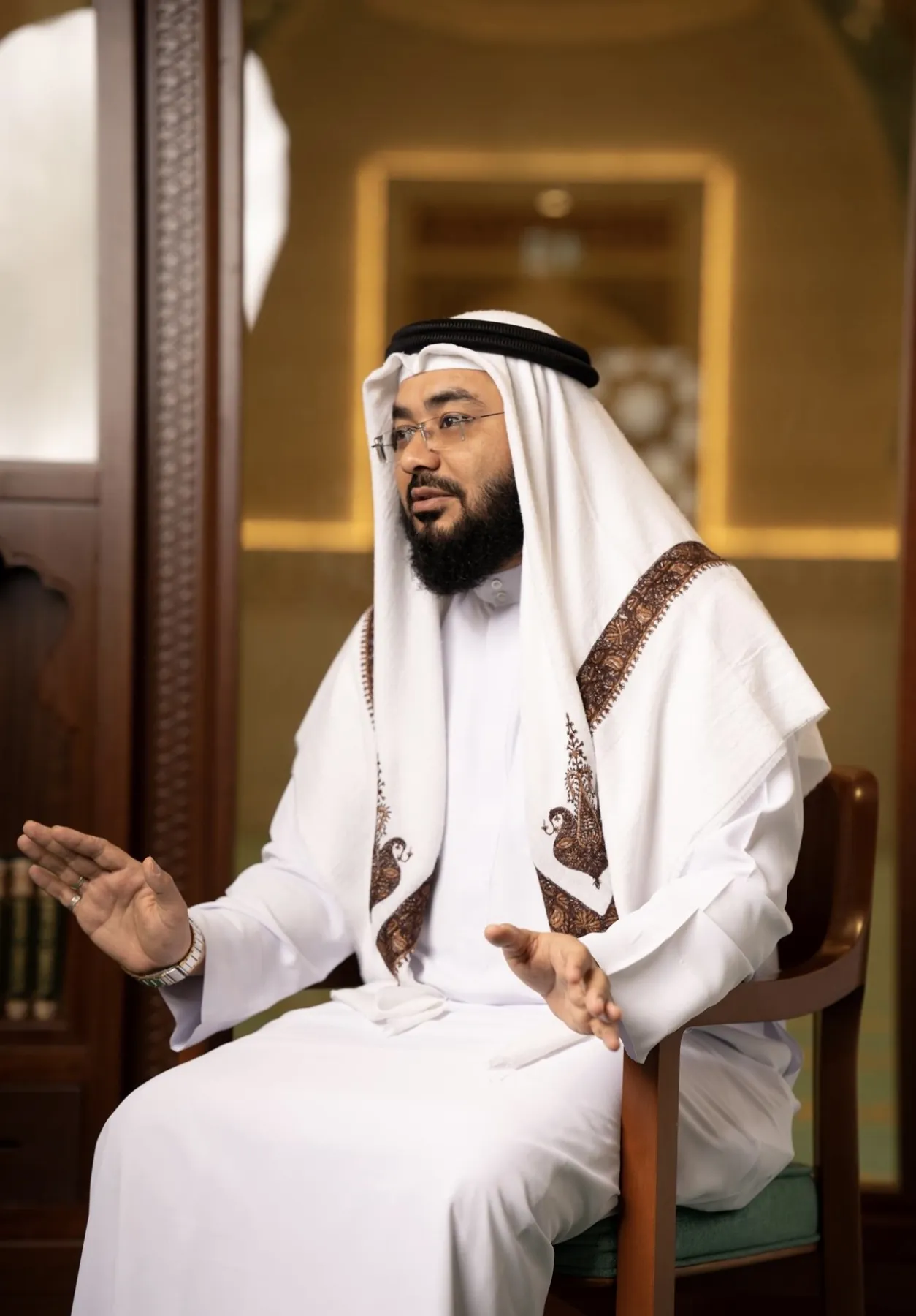 Mufti Habib seated in a masjid, speaking