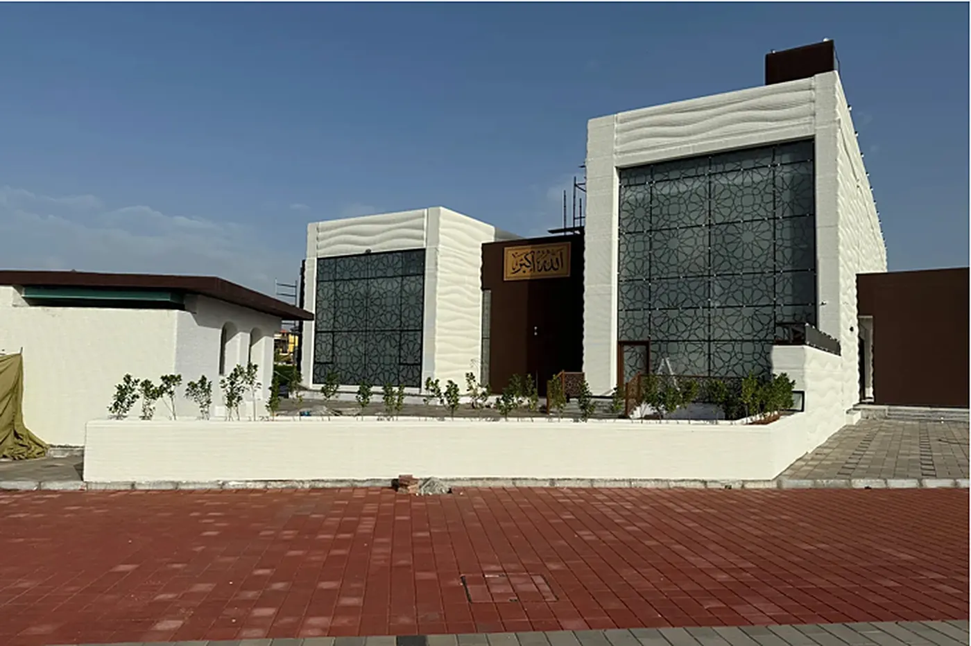 Front of the masjid with the Allahu Akbar plaque